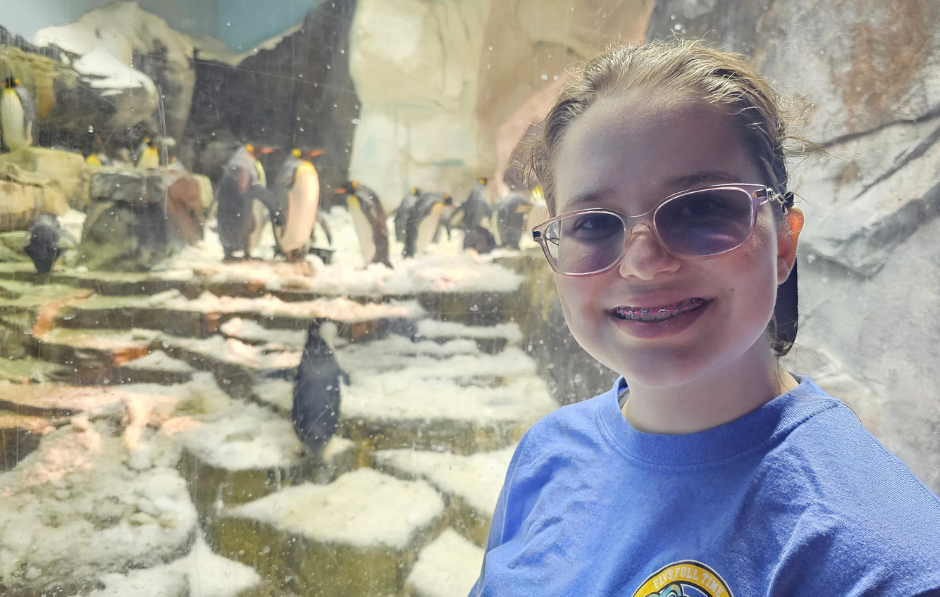 FLVS Full Time middle school student enjoys the penguin exhibit at SeaWorld