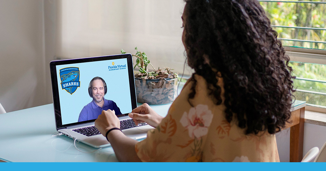 Meet Your FLVS Full Time Counselors student at computer talking to counselor